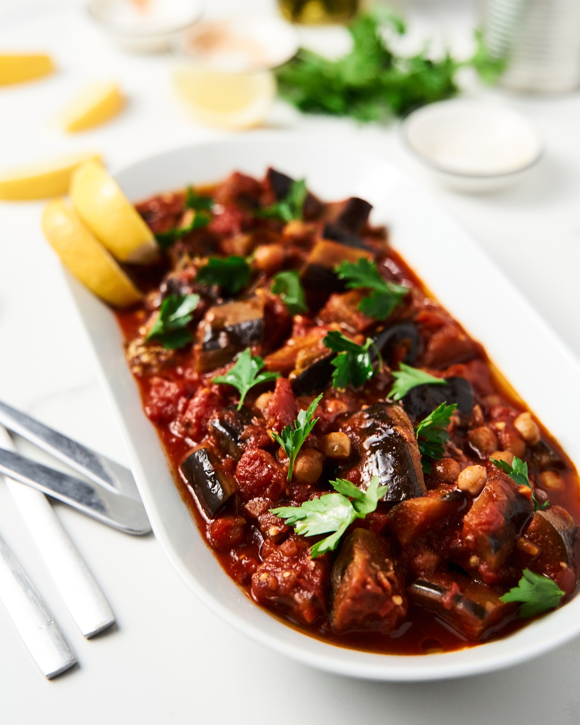 Maghmour or Lebanese moussaka. Dish made from baked or fried eggplant with spices, chickpeas and tomato sauce. Eggplants are stewed in tomato sauce